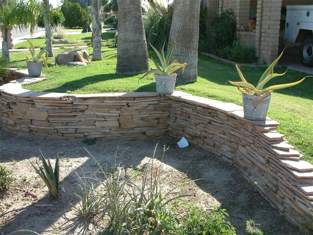 Wall Separates Sod from Shrubs