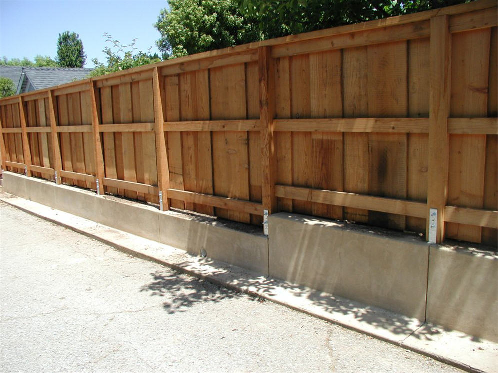 Plank Fence on Concrete Foundation