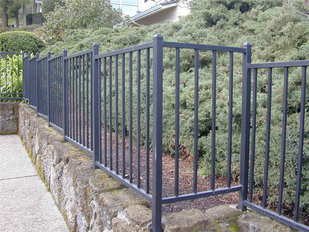 Metal Pool Fence on Stone Wall